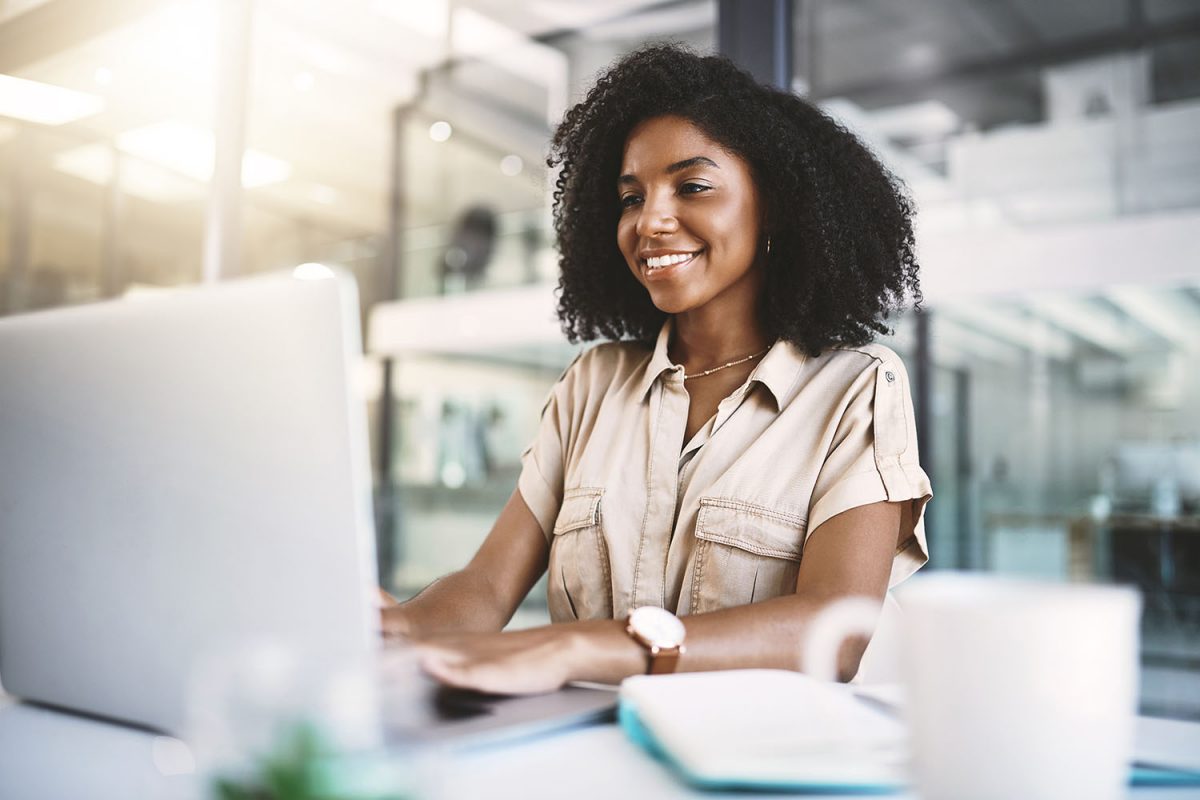 Office, black woman and journalist with laptop for research, typing and information for news article with technology. Workplace, computer and digital writer for planning, reading and creative writing